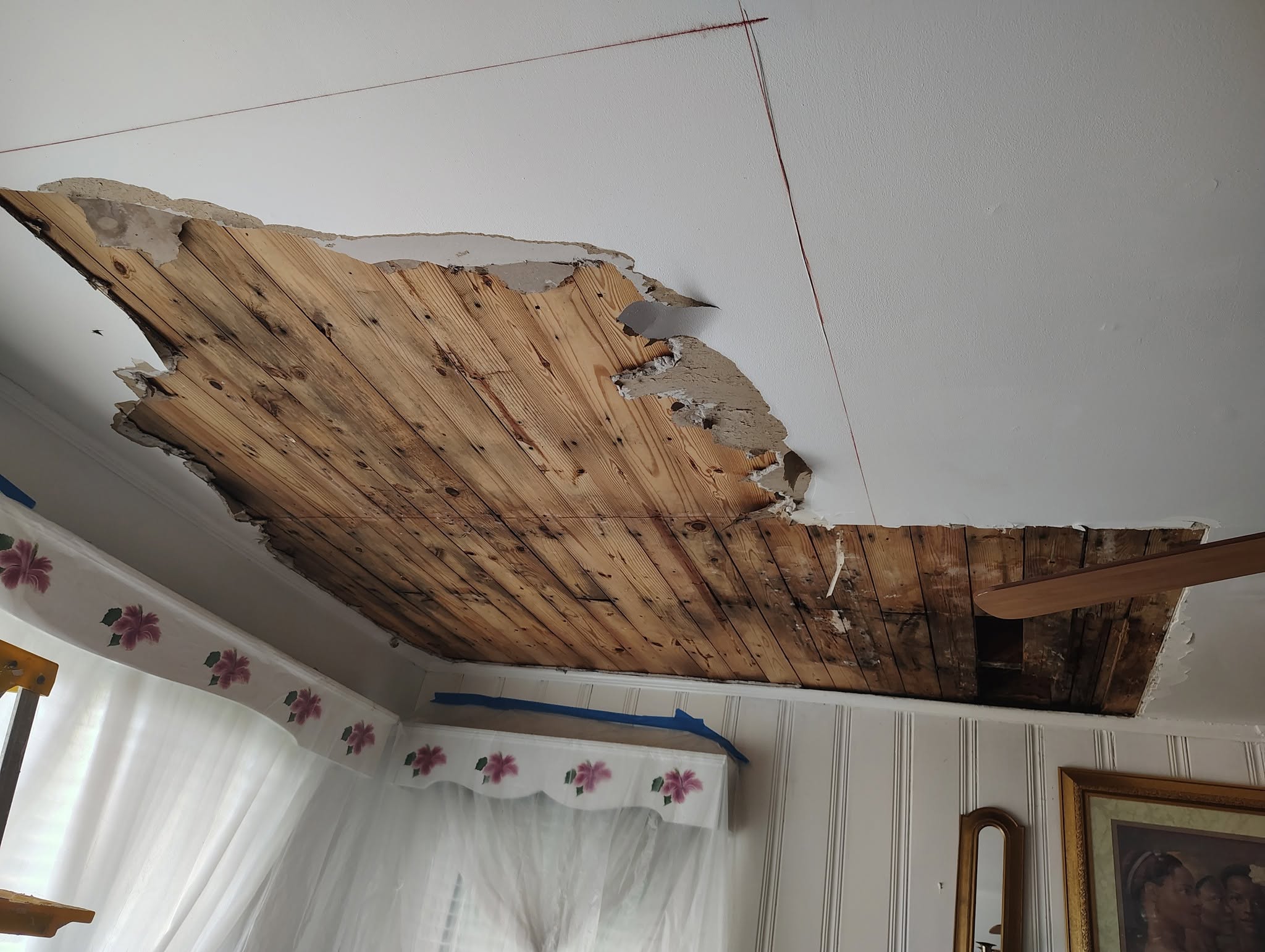 Ceiling damage before restoration